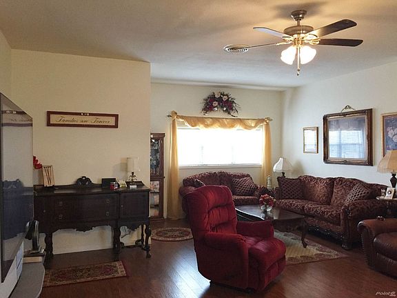 BEAUTIFUL LIVING AREA WITH HICKORY LAMINATE WOOD FLOORS
