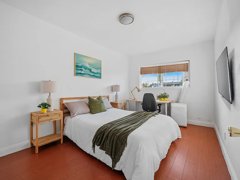 A peaceful bedroom with a workspace_where comfort meets productivity.