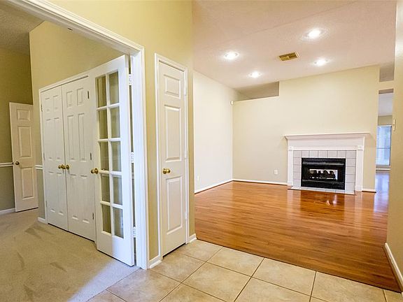 At the entrance, you are greeted with a an office with privacy double glass windowed doors and a family room with a double sided fireplace.