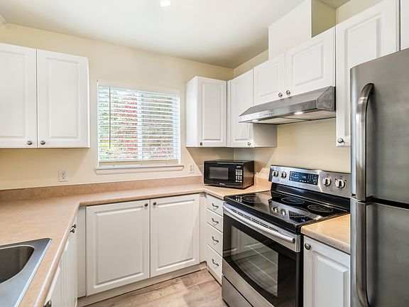 Well appointed kitchen with stainless appliances and plenty of counter space