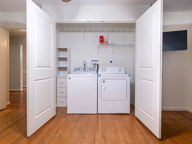 1st floor bedroom combined closet and laundry room.