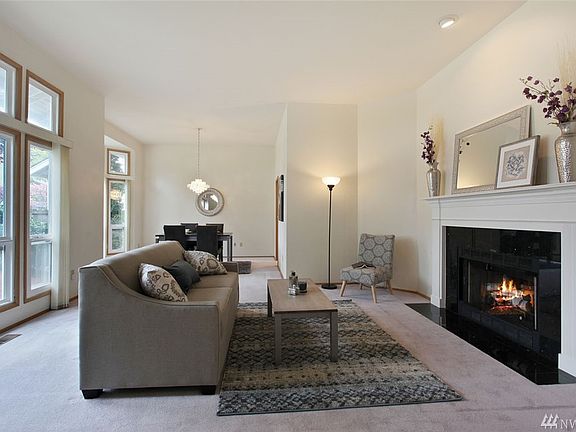 Entertain with easy elegance in this formal living room. Enjoy a beautiful gas fireplace and soaring vaulted ceilings. 
