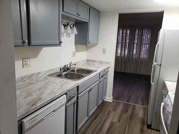 Kitchen with new cabinets and new appliances view looking into Living room.