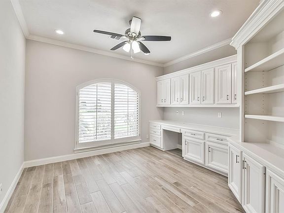 The study with Tile- wood floors, and conveniently located to the left of the entry.