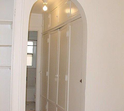 Hall of closets to bath