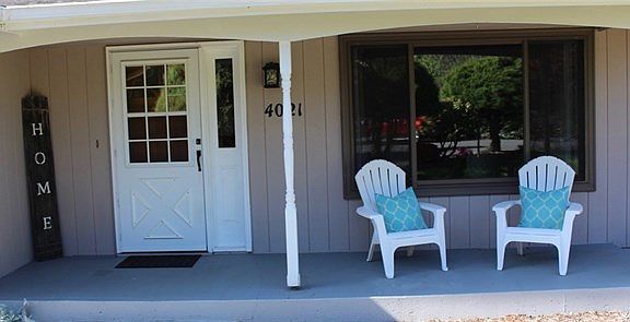 Welcome home!  Charming covered porch greets visitors and is a wonderful place to sit a spell!