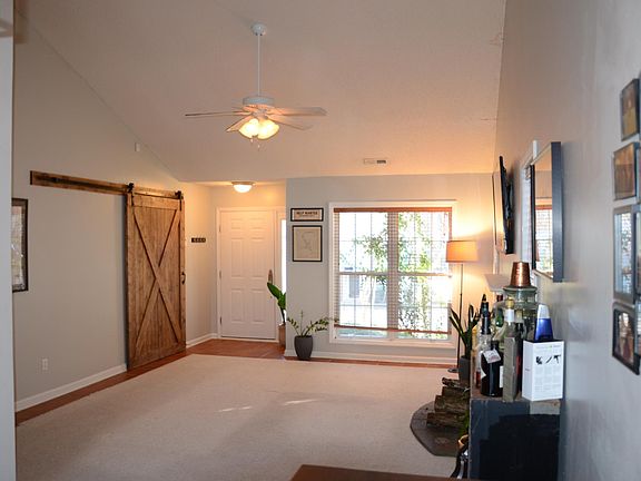 View looking through living room toward front door