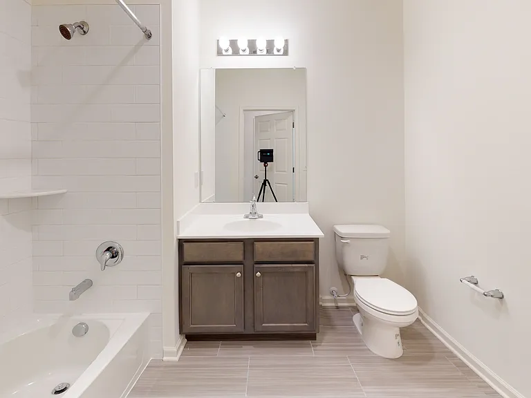 Welcome to Eastampton Village Center, where modern elegance meets functionality. This spacious, well-lit bathroom features stylish cabinetry and luxurious finishes, perfect for your daily routine. Schedule a tour today to see the possibilities!