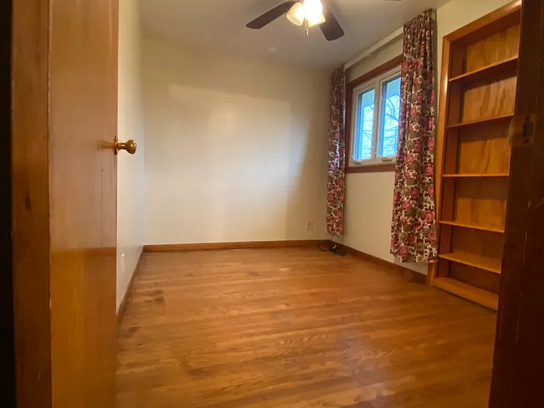 Entryway to Den with built-in -bookcase off the kitchen.