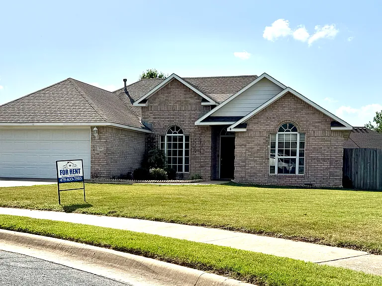 Custom brick home with 2-car attached garage on a quiet street in Lowell _ centrally located in NWA
