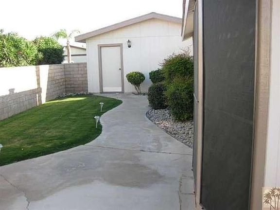 side yard with garage entry door