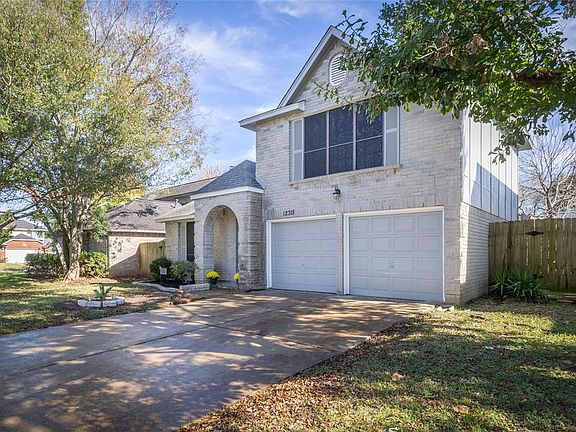 Beautiful exterior w/ fresh paint, new mulch & mature trees.