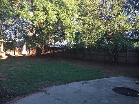 large, shaded backyard