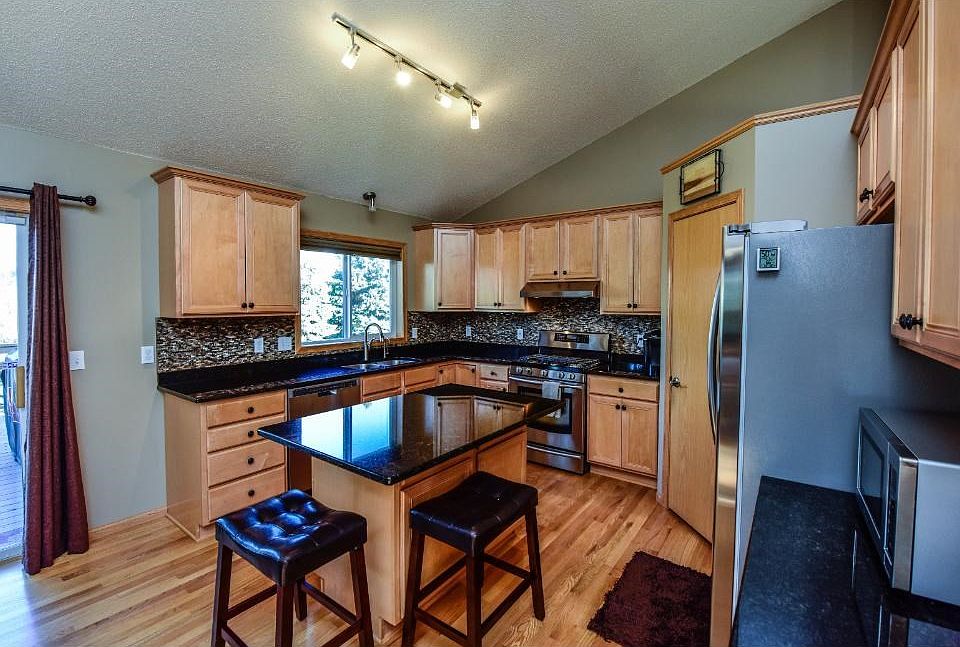 Granite counter tops, ss/appliances, and stone back splash.