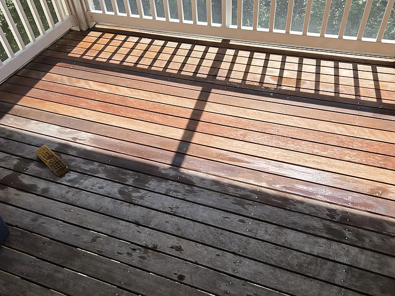 Before and after comparison of decking while washing the teak planks
