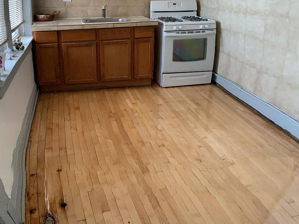 The kitchen includes a stove and frig. in addition, there is a pantry room