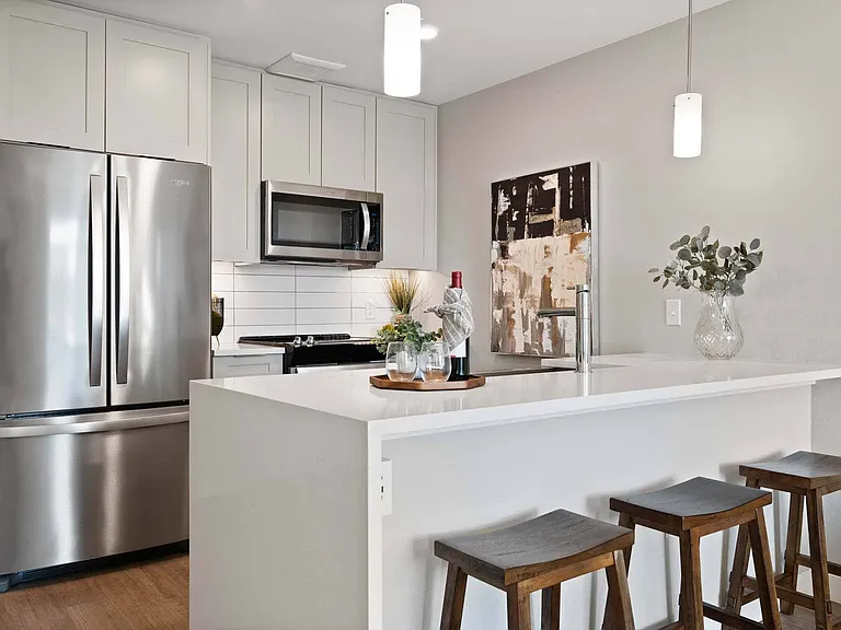 Prepare meals in a kitchen that combines modern design with practical functionality.