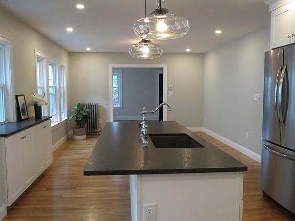Open concept kitchen and dining room. Seating for 4 at the island.