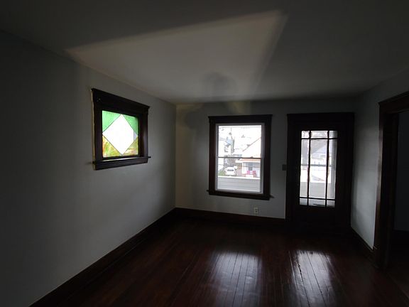 Dining room looking into living room and front porch door