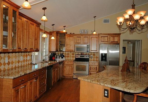 Updated kitchen with maple cabinets and huge island and granite countertops