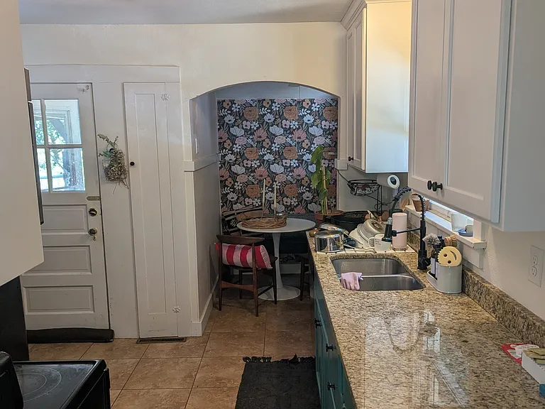 View point of the kitchen & nook from the living room entryway