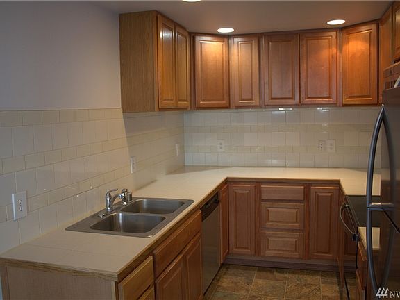 All stainless appliances with tile back splash