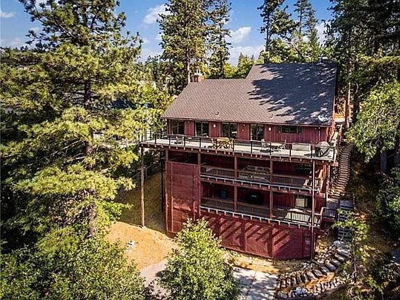 Birds eye view of property. Apartment A is the bottom floor, with steps down to parking pad & driveway.
