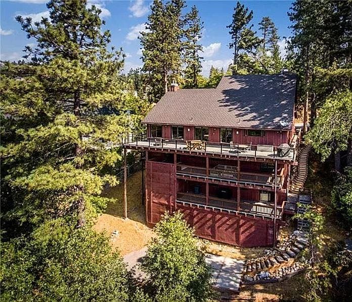 Birds eye view of property. Apartment A is the bottom floor, with steps down to parking pad & driveway.
