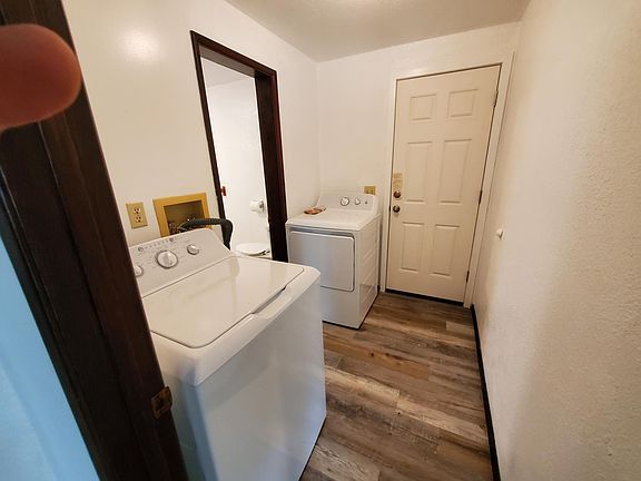Full size washer and dryer included in utility area.