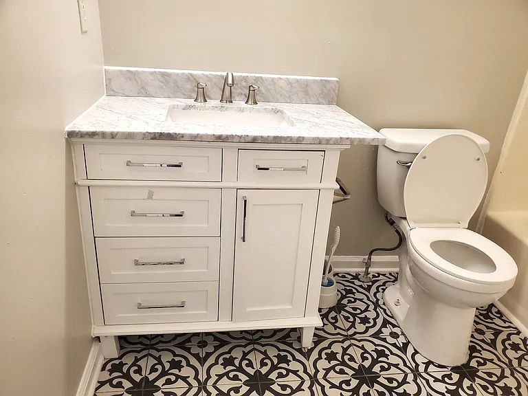 Beautiful bathroom with updated tile floors