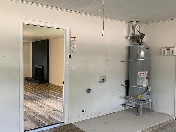 Garage. Opens into Kitchen/dDining area. Washer/Dryer hookups next to hot water heater.