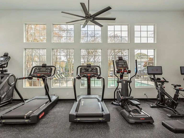 Fitness center is fully equipped with machines and free weights