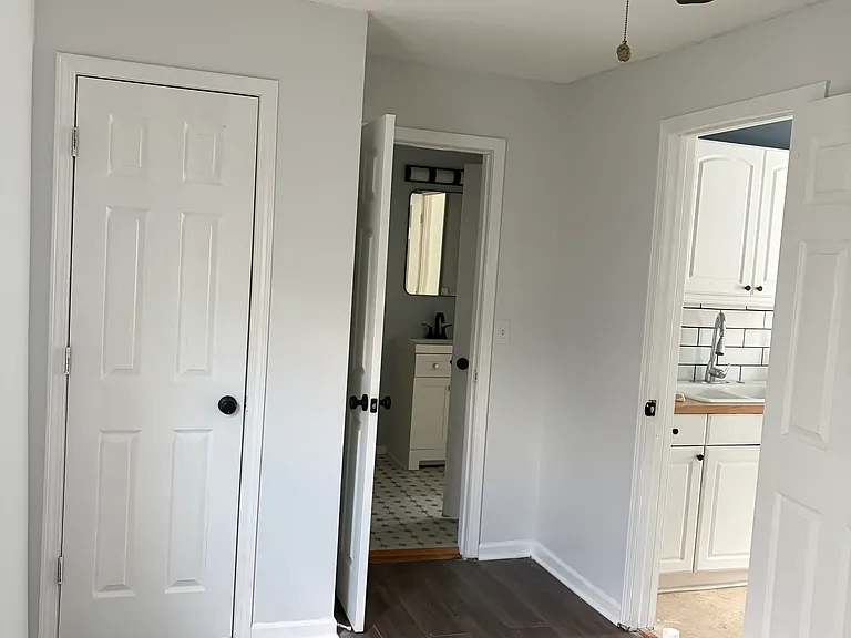 Second bedroom, 7.6' x 12'. Door opens to bathroom and the other to the kitchen.