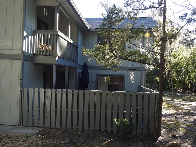 Front view entrance with private fenced patio