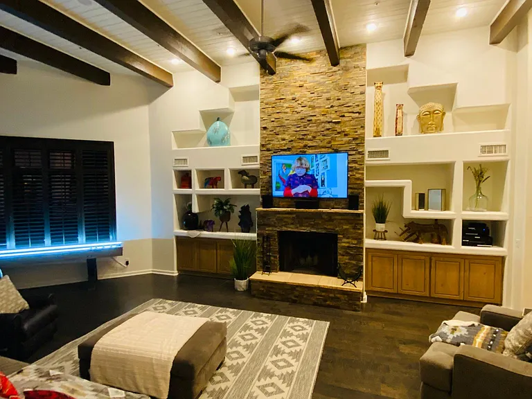Living room with large Smart TV and Surround sound system