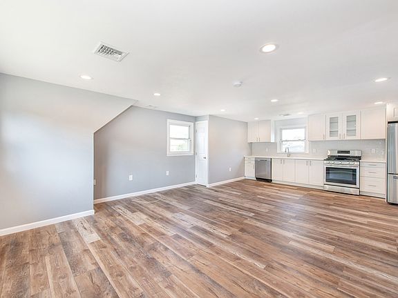 Beautiful Open Concept Living with an abundant of lighting.