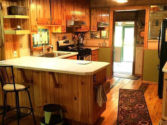 Kitchen with bar and hickory cabinetry