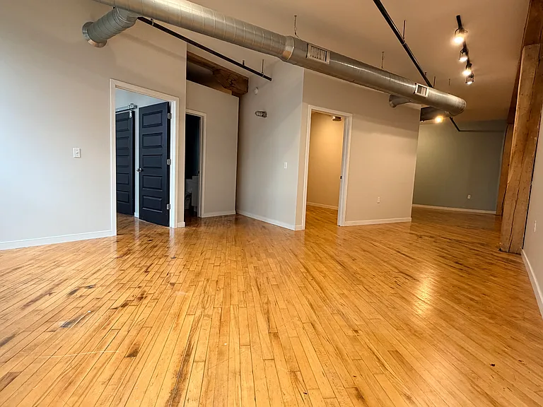 (Photos of similar unit with same floor plan. Unit 211 will have higher exposed beam ceilings. Colors, finishes, and fixtures may vary)