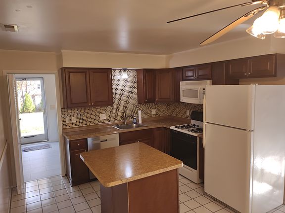 kitchen with handy island and brand new dishwasher