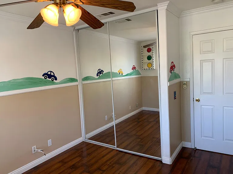 Decorated bedroom with closet and laminate floor for easy to clean.