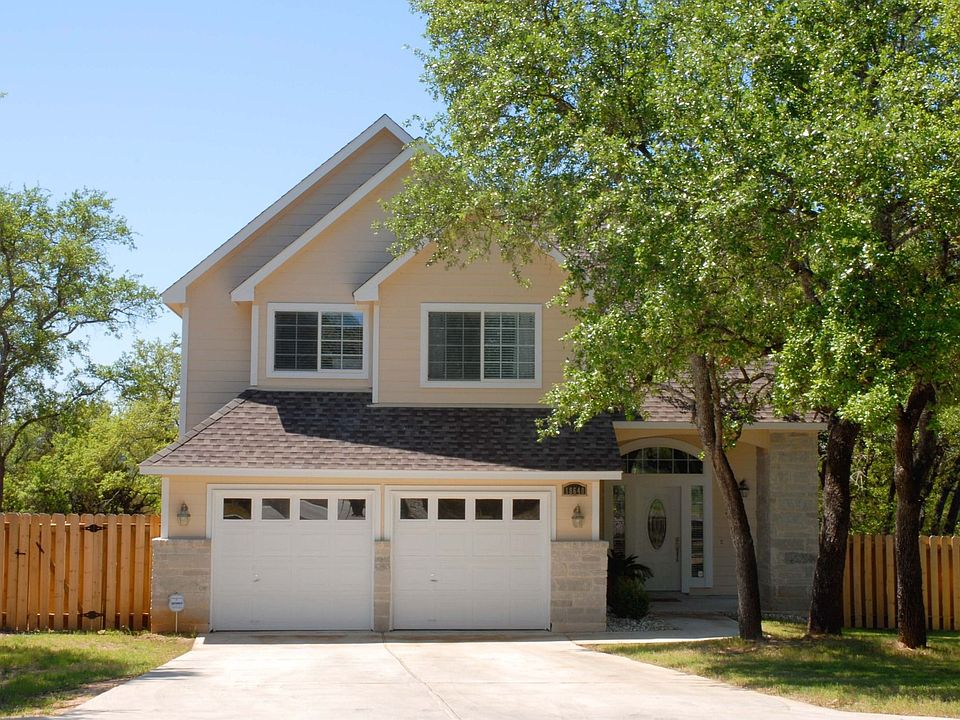 Mature trees surround this lovely home.