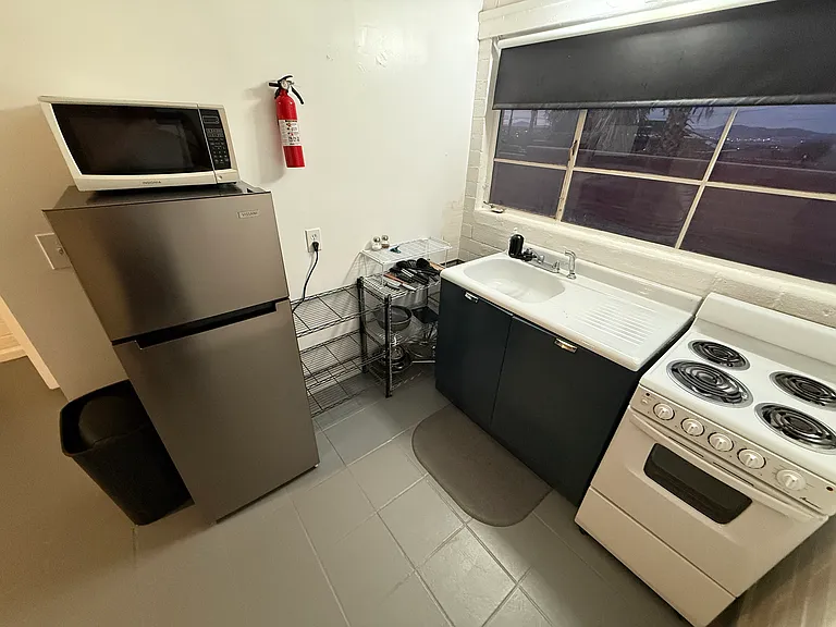 Kitchen with electric stove.