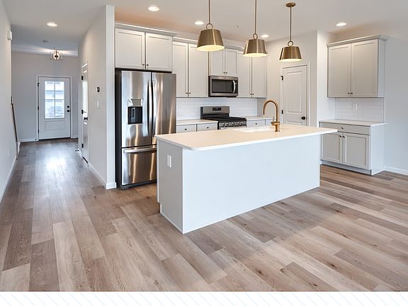 Spacious Kitchen with Upgraded Counter Tops, Refrigerator, Stove, Microwave and Cabinets