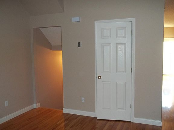 Living Room - door to powder room and entrance to basement.
