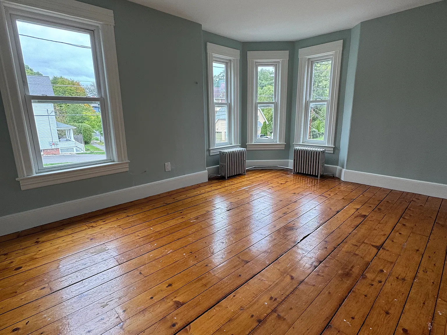 Living room. All wood floors to be refinished. Updated pics to come.