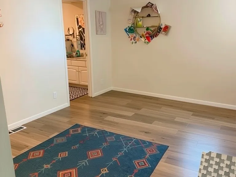 Front room-this is AI edited to show more simple concept and remove personal articles. 10'7"x16