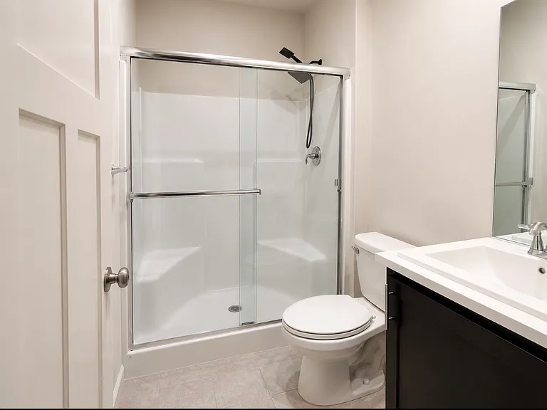 Downstairs full bathroom with walk-in shower.