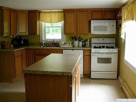 Easy work-in kitchen with plenty of cabinet  & storage space.