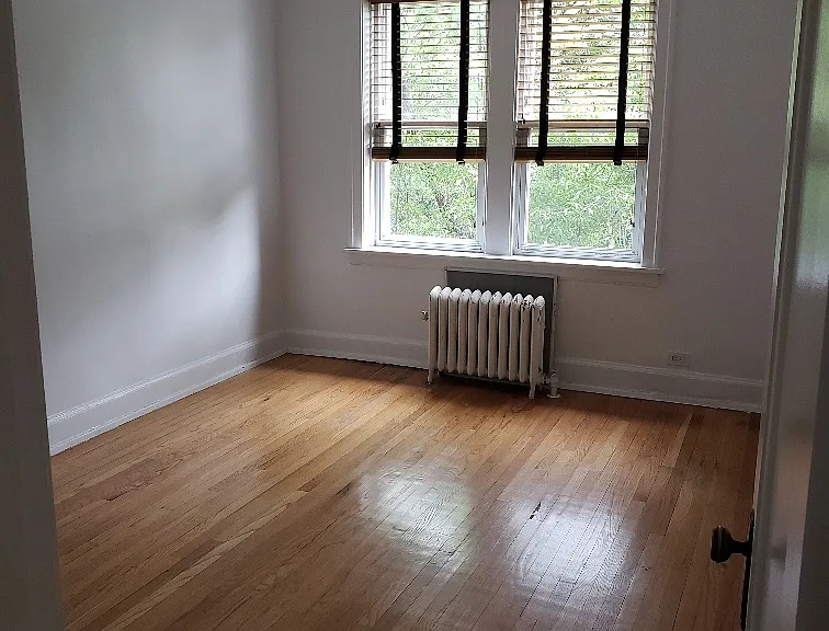 2nd bedroom, hardwood floors, fresh paint, closet, toasty warm radiator w HEAT INCLUDED (such a perk in the cold Chicago winters)