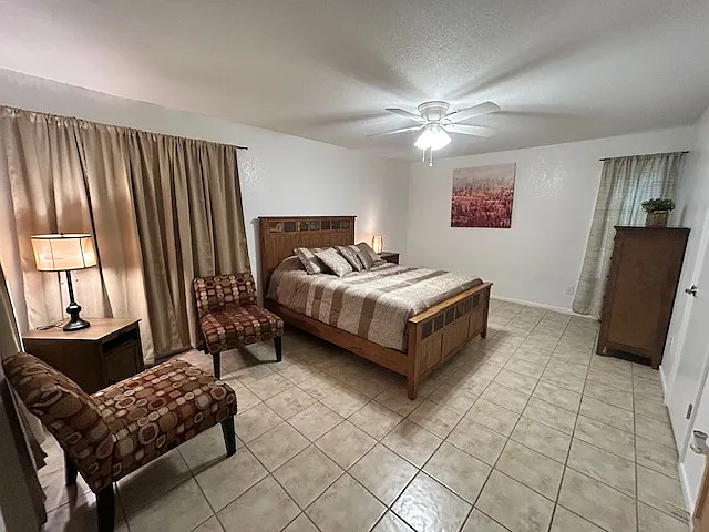 Master bedroom with additional seating.